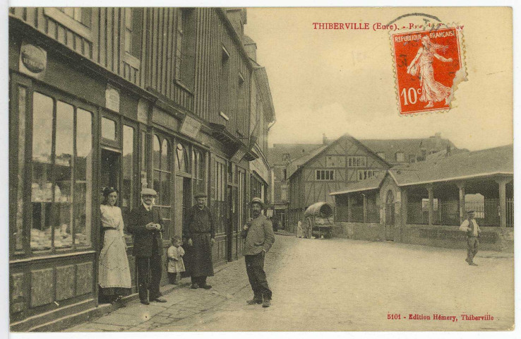 Thiberville. Rue de Bernay et les Halles.
