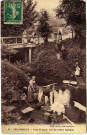 Andelys (Les). Pont et lavoir sur la rivière Gambon.