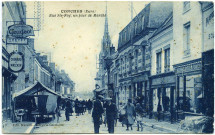 Conches-en-Ouche. Rue Sainte Foy, un jour de Marché.