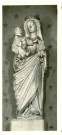 Statue de Vierge à l'Enfant dite "Vierge aux raisins", du XVe siècle, en pierre polychrome, devant un fonds étoilé de l'église de l'église Notre-Dame d'Andé (Eure, France).