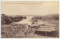 Sainte-Opportune-la-Mare. La Grande Mare - Goudronnage d'une barque.